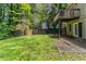 Large backyard with a wooden fence and a small wooden balcony at 5339 Biffle Downs Rd, Stone Mountain, GA 30088