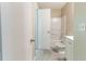 Functional bathroom featuring a tub-shower combo, white toilet, and a vanity with essential fixtures at 5339 Biffle Downs Rd, Stone Mountain, GA 30088