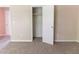 Cozy bedroom with plush carpeting, closet, and neutral walls offering a blank canvas at 5339 Biffle Downs Rd, Stone Mountain, GA 30088