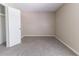 Clean bedroom with neutral walls, fresh carpeting, and a spacious closet for ample storage at 5339 Biffle Downs Rd, Stone Mountain, GA 30088