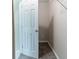 A carpeted walk-in closet features white shelving and an electrical outlet at 5339 Biffle Downs Rd, Stone Mountain, GA 30088