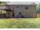 The home's rear exterior features a fenced yard and upper level balcony at 5339 Biffle Downs Rd, Stone Mountain, GA 30088