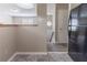 Cozy kitchen area with tile flooring, open access to other living spaces, and modern lighting at 5339 Biffle Downs Rd, Stone Mountain, GA 30088