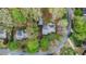 Overhead view of home with surrounding green landscaping and neighborhood streets at 6450 Oak Valley Dr, Cumming, GA 30040