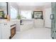 Spacious bathroom with garden tub, tile floors, vanity with dual sinks and glass shower enclosure at 6450 Oak Valley Dr, Cumming, GA 30040