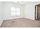 Bright and spacious bedroom with a view to the ensuite bathroom and natural window light at 6450 Oak Valley Dr, Cumming, GA 30040
