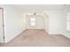 Well-lit bedroom with neutral walls and carpet, with a fan providing ventilation and a comfortable living space at 6450 Oak Valley Dr, Cumming, GA 30040