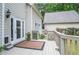 Cozy outdoor deck with adjacent well-maintained yard, offering room for outdoor dining at 6450 Oak Valley Dr, Cumming, GA 30040