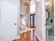 Grand foyer with hardwood floors, a staircase, a chandelier, and decorative front doors at 6450 Oak Valley Dr, Cumming, GA 30040
