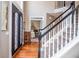 Bright foyer with staircase, decorative door and hardwood floors at 6450 Oak Valley Dr, Cumming, GA 30040