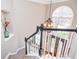 View of foyer showing entry door, staircase with dark wood banister and large window at 6450 Oak Valley Dr, Cumming, GA 30040