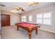 Game room equipped with a pool table and hardwood cabinet, ideal for entertainment and relaxation at 6450 Oak Valley Dr, Cumming, GA 30040