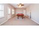 Spacious game room with a pool table, neutral colors, and a ceiling fan at 6450 Oak Valley Dr, Cumming, GA 30040