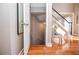Hallway featuring hardwood floors, staircase, and view into a lower level at 6450 Oak Valley Dr, Cumming, GA 30040