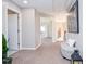 Spacious hallway with carpeted floors, neutral walls, and ample natural light at 6450 Oak Valley Dr, Cumming, GA 30040
