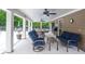 Comfortable covered patio with ceiling fans and ample seating for outdoor relaxation and entertaining at 6450 Oak Valley Dr, Cumming, GA 30040