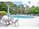 Community pool and deck with lounge chairs and tables at 6450 Oak Valley Dr, Cumming, GA 30040