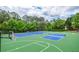 Enjoy the great outdoors with this updated tennis court, pickleball court and basketball court at 6450 Oak Valley Dr, Cumming, GA 30040