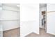 Well-organized walk-in closet with bright, adjustable shelving units and soft carpeted floors at 6450 Oak Valley Dr, Cumming, GA 30040