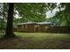 The backyard is spacious with a wooden fence and a brick exterior at 1140 Allgood Rd, Stone Mountain, GA 30083