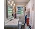 Cozy bathroom with a vanity, toilet, and decorative shower curtain, providing a clean and functional space at 1140 Allgood Rd, Stone Mountain, GA 30083