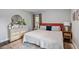 Bright bedroom with a dresser, comfortable queen bed, natural light and warm tones at 1140 Allgood Rd, Stone Mountain, GA 30083