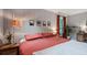 Bedroom with hardwood floors, paneled walls, stylish furnishings, natural light and view to the outdoors at 1140 Allgood Rd, Stone Mountain, GA 30083