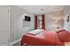 Bedroom with mounted TV, paneled walls, neutral carpet and access to light from the window at 1140 Allgood Rd, Stone Mountain, GA 30083