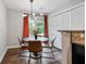 Cozy dining area with a modern chandelier, large window, and neutral decor at 1140 Allgood Rd, Stone Mountain, GA 30083