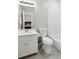 Bathroom with subway tile, white vanity and modern fixtures next to the toilet and shower at 2572 Hillgrove Dr, Dacula, GA 30019