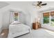 Bedroom with natural light, a ceiling fan, and window treatments creating a cozy atmosphere at 2572 Hillgrove Dr, Dacula, GA 30019