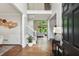 Inviting foyer with hardwood floors, a staircase, and views into the living areas at 2572 Hillgrove Dr, Dacula, GA 30019