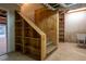 Staircase in basement with built-in shelving at 355 Clark Creek Pass, Acworth, GA 30102