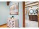 Elegant bathroom showcasing a wooden vanity, stone countertops, and artistic wall accents at 355 Clark Creek Pass, Acworth, GA 30102
