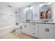This bathroom features a double vanity, granite counters, and decorative tile at 355 Clark Creek Pass, Acworth, GA 30102