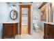 Open bathroom featuring dual vanities, a water closet, and access to a walk-in closet at 355 Clark Creek Pass, Acworth, GA 30102