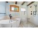 Elegant bathroom with standalone tub, glass shower, decorative tile, and natural light at 355 Clark Creek Pass, Acworth, GA 30102