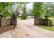 Long, gated driveway leads to a beautiful home at 355 Clark Creek Pass, Acworth, GA 30102