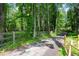 A winding driveway through lush greenery leading to the residence at 355 Clark Creek Pass, Acworth, GA 30102