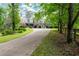 Stately brick home with manicured landscaping and a circular driveway at 355 Clark Creek Pass, Acworth, GA 30102