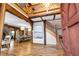 Elegant foyer featuring wood floors, exposed beams, staircase, and formal dining room at 355 Clark Creek Pass, Acworth, GA 30102
