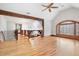 Hallway with beautiful hardwood floors, wood beam accents, chandelier, and natural light at 355 Clark Creek Pass, Acworth, GA 30102