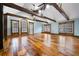Expansive living room featuring exposed beams, hardwood floors, and natural light at 355 Clark Creek Pass, Acworth, GA 30102
