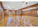 Spacious living room with wood flooring, wood paneling, and exposed beams at 355 Clark Creek Pass, Acworth, GA 30102