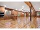 Expansive living room featuring beautiful wood paneling, beams, and hardwood floors at 355 Clark Creek Pass, Acworth, GA 30102