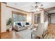 Bright living room featuring wood beams, hardwood floors, neutral color palette, and a large window at 355 Clark Creek Pass, Acworth, GA 30102