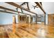 Open living room with exposed beams, wood floors, and custom built-in storage at 355 Clark Creek Pass, Acworth, GA 30102