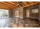 Enclosed back porch features slate floors, wood ceilings, and stone walls with doors to the backyard at 355 Clark Creek Pass, Acworth, GA 30102
