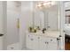 Bathroom featuring a shower, vanity, and a glimpse into the main bedroom at 4390 Wicklow Ct, Suwanee, GA 30024
