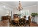 Elegant dining room with a chandelier, round table, and stylish chairs at 4390 Wicklow Ct, Suwanee, GA 30024
